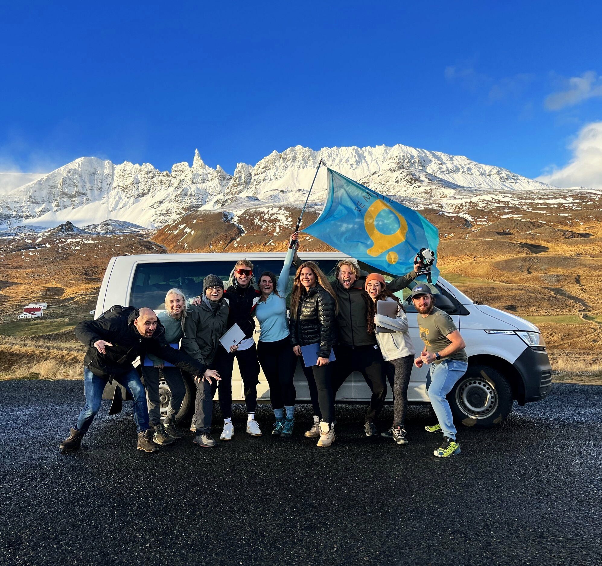 Smiling group in front of a van in Iceland